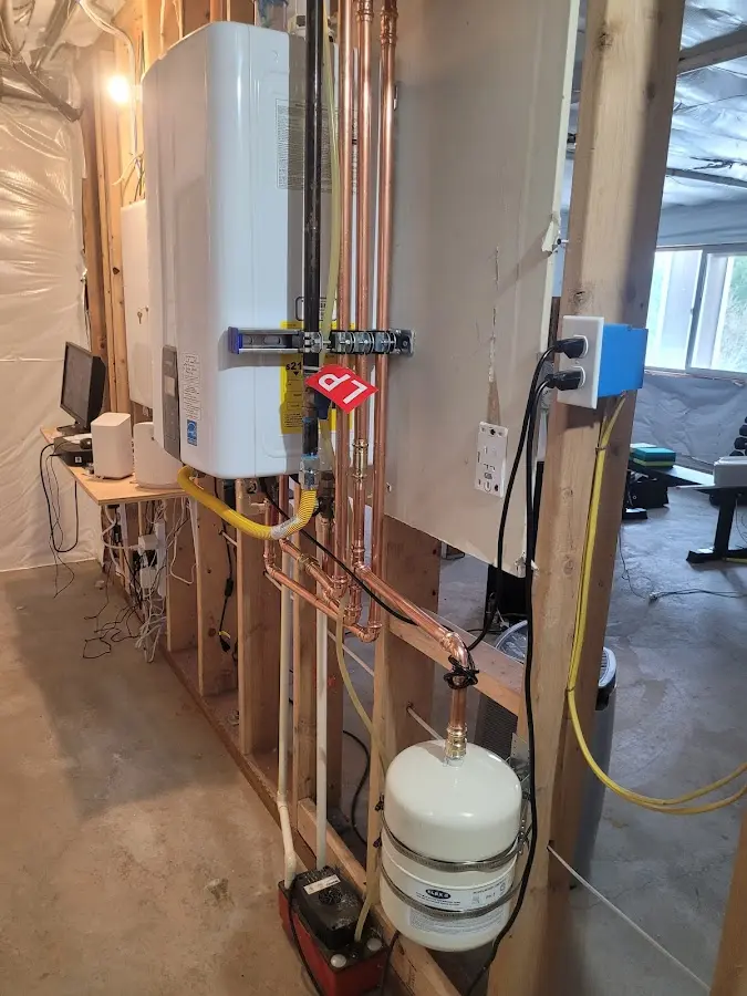 Licensed plumber repairing a kitchen sink in Redland